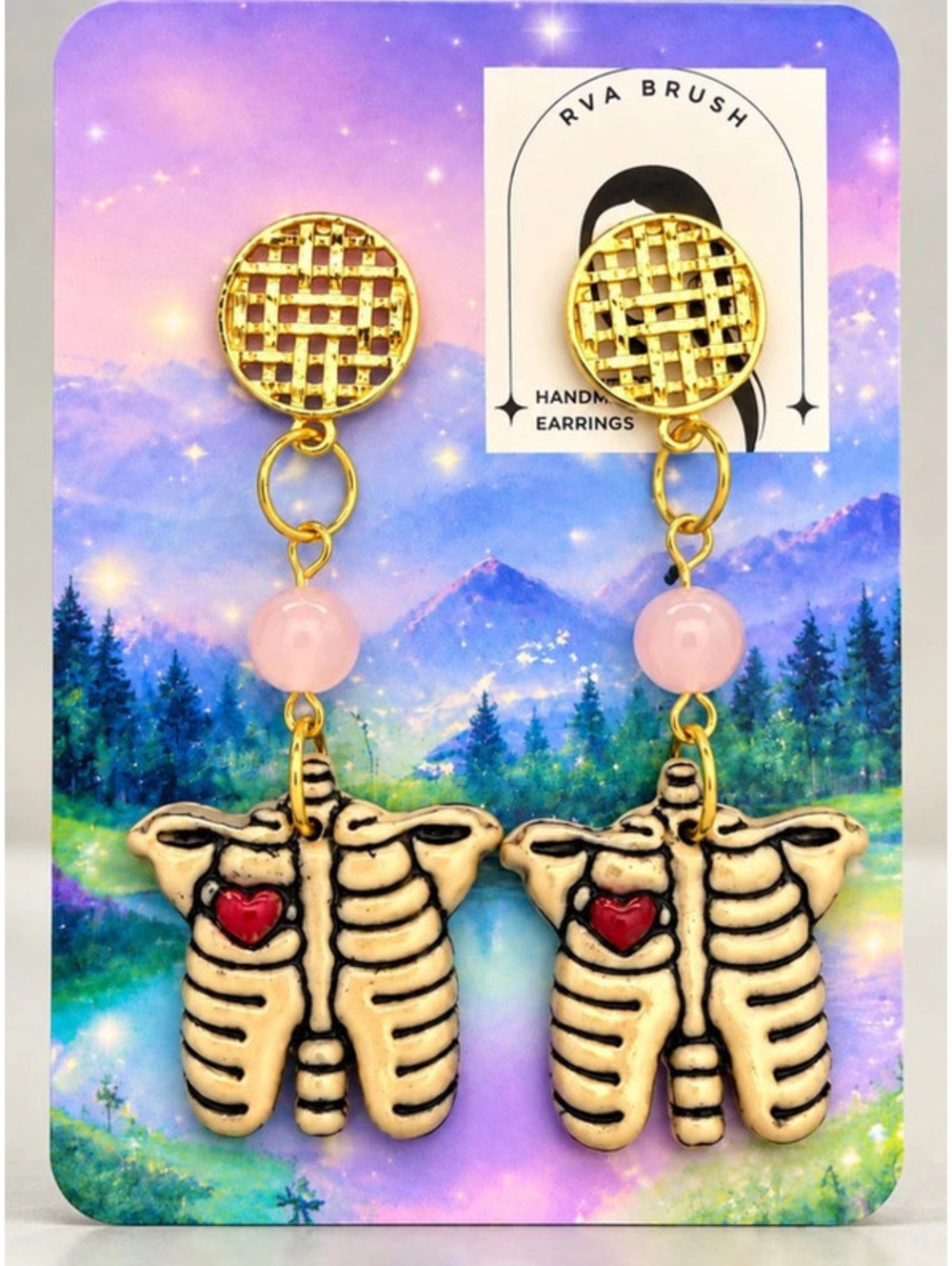 Handmade anatomical rib cage earrings featuring tiny heart details